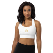 Model posing in the Astral Signature Longline Sports Bra, highlighting its flattering fit and suitable for both workouts and everyday wear in active fashion.