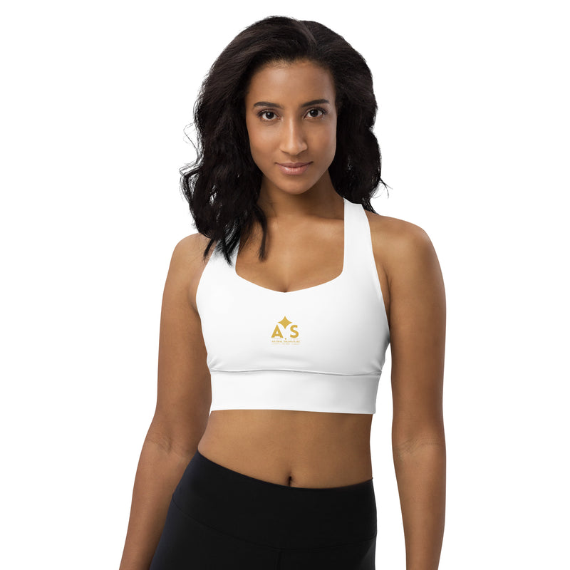 Model posing in the Astral Signature Longline Sports Bra, highlighting its flattering fit and suitable for both workouts and everyday wear in active fashion.