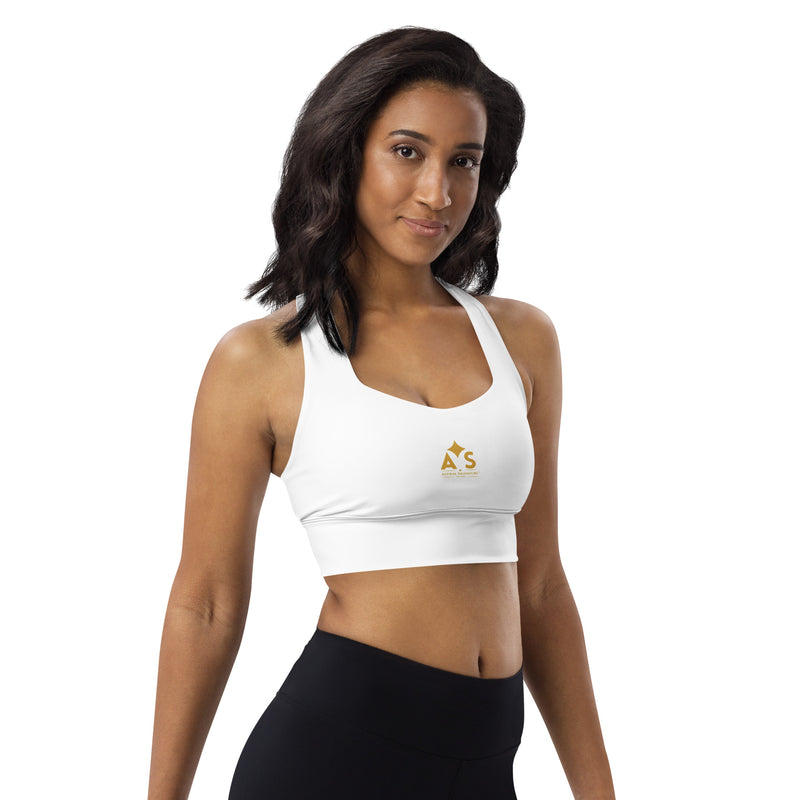 Model showcasing the Astral Signature Longline Sports Bra with a confident pose, perfect for workouts and fashionable activewear ensembles.