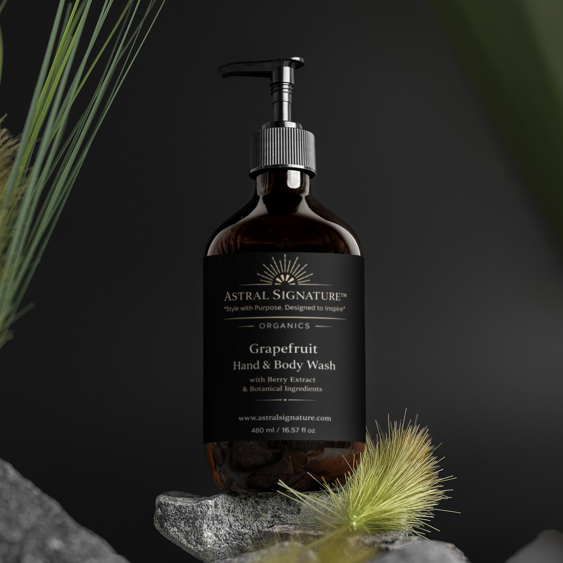Astral Signature™ Hand & Body Wash Cleanses, Grapefruit showcased in an elegant amber bottle, suitable for all skin types. Enriched with Betaine for hydration, this body wash effectively addresses cleansing concerns for dehydrated skin. A perfect addition to any body-care routine, its gentle formula is both vegan and skin-friendly.