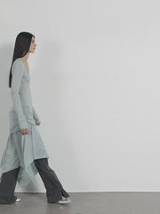 Dynamic model pose in the Dreamy Ball Wool Dress by PremiumStyle Co.,Limited, showcasing the fluid movement and stylish asymmetric hem in light gray. This Asymmetric Hem Wool Dress is an exemplary piece of women's fashion for modern wardrobes.