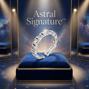 The Geometric Luxe Ring displayed on a blue velvet pedestal, highlighting its sophisticated white gold plated Eco-Brass and sparkling zirconia, designed by Astral Signature.