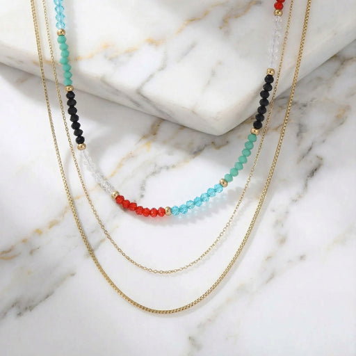 A detailed shot of the Rainbow Aura Layers necklace featuring 14K Gold Plated Stainless Steel and vibrant beads by Astral Signature. This stylish jewelry is perfect for everyday wear, making it an ideal gift for her and a unique limited edition accessory.