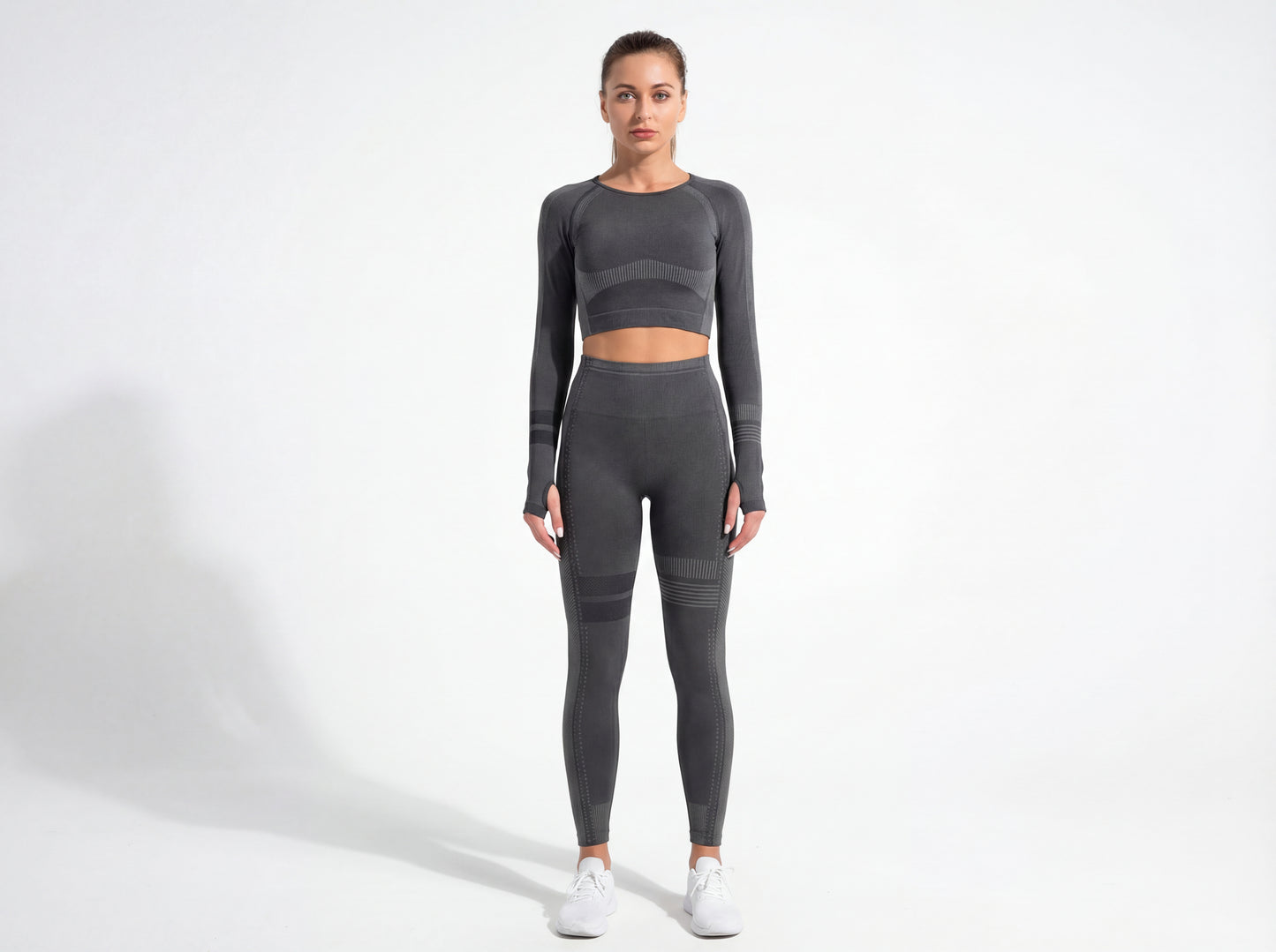 Model wearing the Shadow Flex Yoga Set by CHARMING BUNNY, featuring a fitted long-sleeve crop top and matching leggings in black, offering stylish support for workouts. Ideal for yoga and training sessions. APPAREL, BASICS & ACTIVEWEAR, Black, CCPRODUCTS, NEW ARRIVALS, SETS.