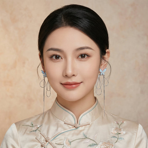 Model wearing Ethereal Butterfly Earrings by Astral Signature, showcasing the unique butterfly design that embodies elegance and motion. Crafted from White Gold Plated Eco-Brass with zirconia, these earrings serve as a stunning Gift for Her with hypoallergenic S925 sterling silver posts.