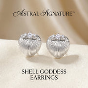 Elegant Shell Goddess Earrings placed on a satin background, featuring the intricate design and zirconia sparkle from Astral Signature™. These earrings make the perfect gift for her, combining white gold plated eco-brass with the quality of sterling silver (S925).