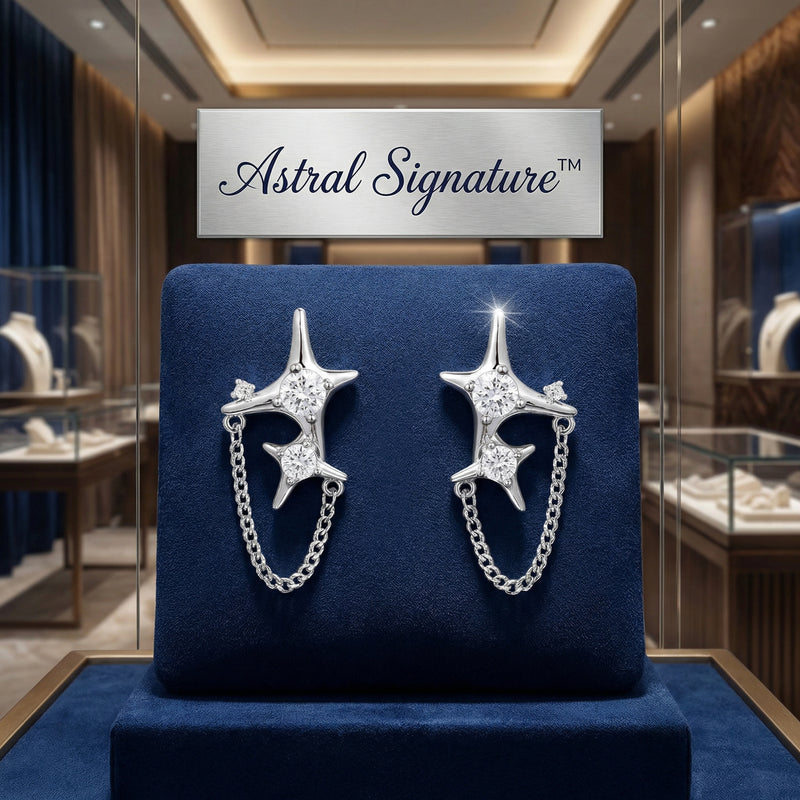 Elegant display of Stardust Chain Studs earrings on a jewelry stand by Astral Signature, crafted from Eco-Brass and featuring sparkling Zirconia. These sterling silver (S925) studs make for a sophisticated gift for her.