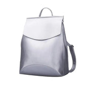 Side view of the shiny silver Urban Guard Backpack by Stevvex, highlighting its sleek contours and fashionable design. Shop at Shopify Collective.