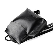 Sleek gray Urban Guard Backpack by Stevvex displayed in various angles, emphasizing its chic and practical features. Shop at Shopify Collective.