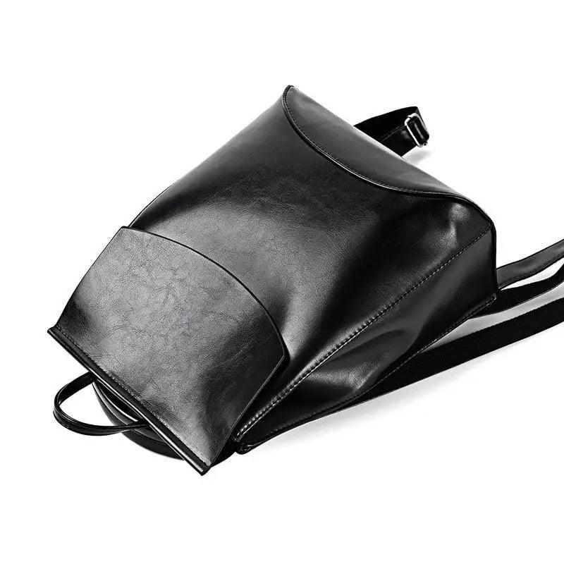 Sleek gray Urban Guard Backpack by Stevvex displayed in various angles, emphasizing its chic and practical features. Shop at Shopify Collective.