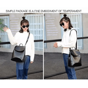 A model waving while holding the Urban Guard Backpack by Stevvex in black, representing casual yet chic urban style. Available at Shopify Collective.