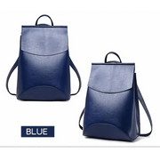 Style display of the Urban Guard Backpack by Stevvex, featuring a model and an issue of Vogue showcasing its elegance. Available at Shopify Collective.