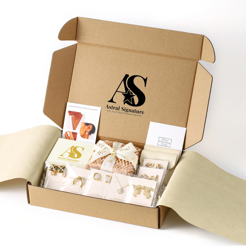 Astral Signature packaging for the 14K gold plated floral jewelry set, displaying an elegant unboxing experience with curated contents.