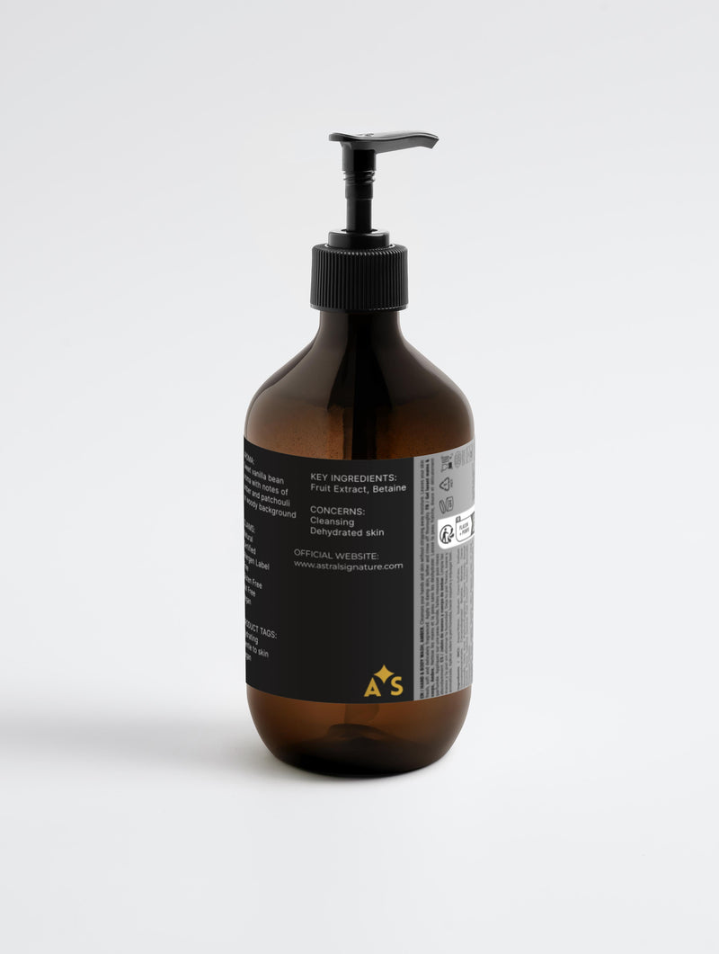 Back view of Astral Signature Hand & Body Wash, Patchouli & Amber Vanilla showcasing key ingredients such as Betaine. This body wash, presented in amber packaging, is perfect for all skin types, vegan, gentle to skin, and free of gluten and nuts, promising hydration and effective cleansing.