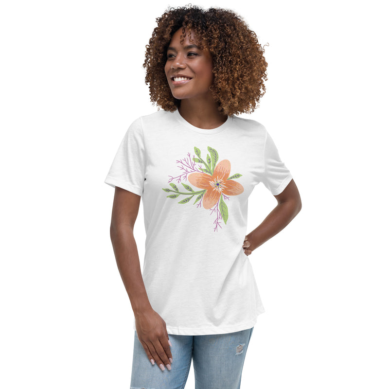 Model confidently wearing the Women’s Relaxed Tee - Astral Spring T-Shirt by Astral Signature, showcasing its floral design. This limited edition women's top is a thoughtful gift for her, blending style and comfort.