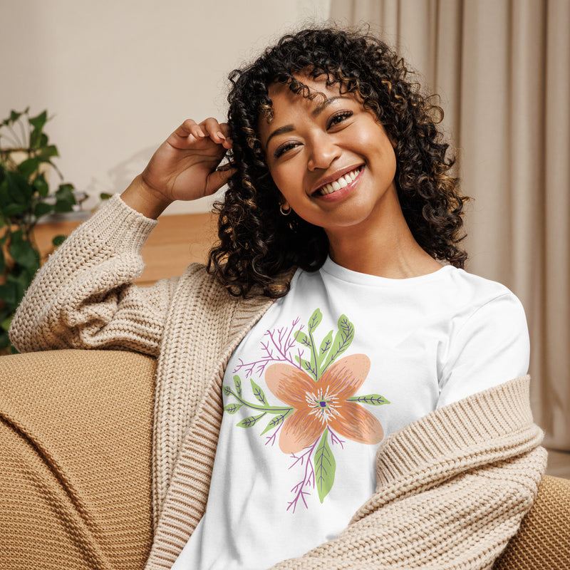 Model smiling while wearing the Women’s Relaxed Tee - Astral Spring T-Shirt by Astral Signature, showcasing its versatility. This limited edition women’s top makes a stylish gift for her, ideal for various casual occasions.